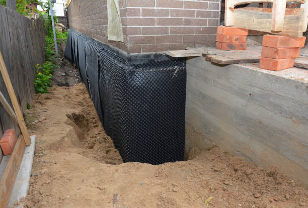 SJ Waterproofing Pros technician performing targeted Emergency Waterproofing assessment in Troy, IL